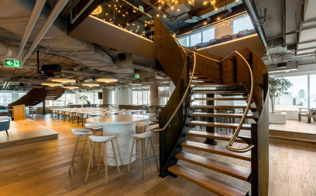 A wooden stairwell in one of Shopify’s open plan offices